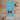 Towel with a cat illustration and text 'It's All About the Cattitude' on a blue background