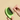 Avocato Pet Comb shaped like a green avocado with brown pit design