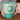 Cat Mom 20oz Mug ā light teal coffee mug with yellow polka dots and black-and-white cat face print.