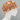 Patterned shower cap on a mannequin head against a white background