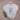 Gray t-shirt with black cat illustrations on a hanger with a branch and leaves.