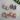 Handmade teardrop earrings featuring cat in sweater and glasses with copper edging