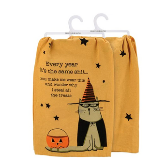 Humorous dish towel featuring a grumpy cat in a Halloween costume against a backdrop of eerie yellow with black star motifs.