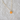 Close-up of Orange Cat Face Gold Necklace on white background