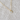 Gray cat gold necklace laid flat on linen background