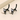 Black cat-shaped earrings on a beige background
