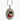 Silver locket featuring a black and white kitten and red rose motif, perfect for cat lovers.