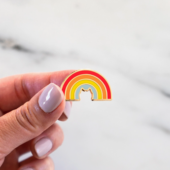 Adorable cat enamel pin with gold plating and vibrant rainbow hues.
