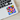 Pop Art Cat Sticker with a vibrant multi-colored cat face on a laptop.