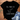 Black t-shirt with a cat graphic and text, placed on a white background with sunglasses and jeans.