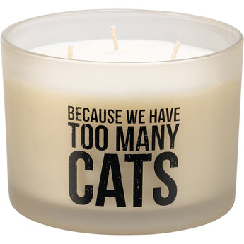 Glass candle with the phrase 'Because We Have Too Many Cats' in black font