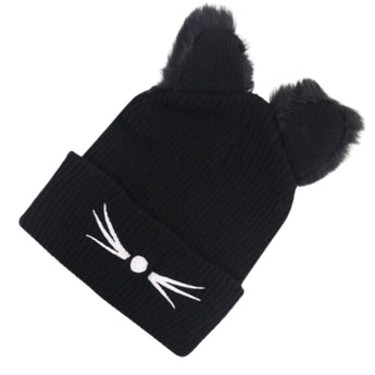 Close-up of Black Cat Hat showing plush 3D cat ears and printed whiskers and nose.