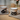 Two mugs with black animal illustrations on a wooden surface.