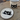 Ceramic mug and plate with black cat designs on a textured surface