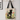 Black Cat Tote Bag featuring a black cat with green eyes among vibrant flowers.