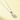 A silver-toned necklace with a small cat-shaped pendant and a dark blue gemstone accent, displayed on a soft cream background.