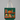 A tote bag with a cat and books laid out flat