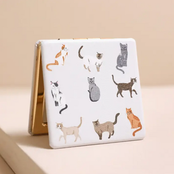Adorable Cat Compact Mirror featuring various cat breeds on a light beige background.