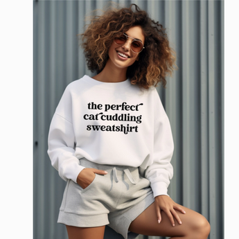 Cat Cuddling Sweatshirt: White crewneck sweatshirt with black text 'The Perfect Cat Cuddling Sweatshirt'.
