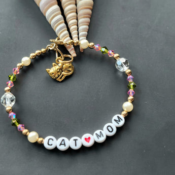 Elegant Cat Lover Bracelet adorned with pearls, Swarovski Crystals, and gold pewter cat charm.