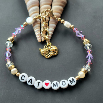  Unique Cat Mom Bracelet showcasing Cultured Pearl Coin-Shaped beads, Swarovski Crystals, and gold pewter cat charm.