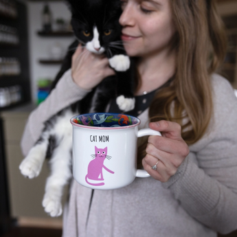 Purple cat design on the Cat Mom Mug with colorful interior detailing.