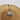 Silver necklace with a round pendant on a wooden surface