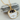 Cat In A Cup necklace with a gold-tone black cat peeking from a coffee mug pendant.