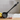 Black ladle with cat-shaped handle on a white background