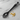 Black pasta server with cat handle on a white background