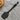 Black slotted spatula with cat-shaped handle on a white background