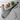 Black whisk with a cat-shaped handle on a white background