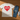 Beige t-shirt with a red heart and 'CATS' text on a white background