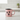 Pink mug with black paw prints and 'Mom' text on a white background