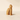 Wooden cat-shaped object on a beige background