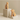 Wooden cat and dog bookends on beige plinths against a beige background