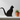 Black cat-shaped object on a white background