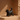 Black cat-shaped vase on a beige background