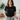 Black t-shirt with a cat heartbeat design next to a brown hat on a white background