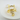 Gold cat-shaped ring on a white background