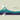 Simplified mountain landscape with a winding path and motivational quote on a beige background