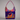 Colorful handbag with a cat design on a white background