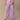 Cat print pajama pants featuring a lot of different cats ion a light purple fabric.