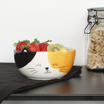 Happy calico cat cereal bowl with a smiling face, black nose, and whiskers
