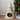 Cat bed designed like a tree with colorful pom-poms on a white background