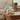 Small pouch with a cat design on a wooden table in a home setting
