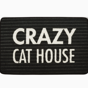 Machine-washable Crazy Cat House floor mat, displayed flat for easy drying.