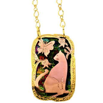 Handmade in the USA cat shaped pendant mixing gold and copper metals - a great gift for cat ladies.