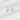 Rose gold cat-shaped earrings on a light gray background