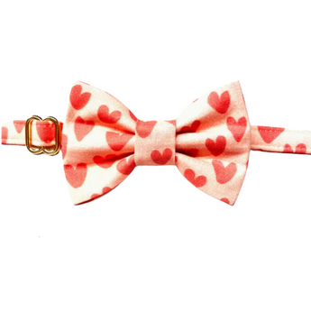 A matching pink bow tie with elastic attachment, designed to complement the Feline The Love Cat Collar, perfect for adding a touch of style to your feline friend's ensemble.